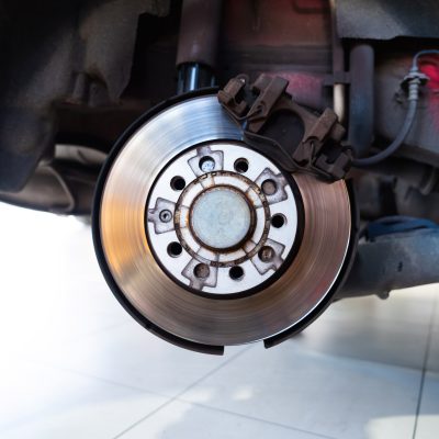 close-up-of-a-car-disc-brake-system-in-a-garage-2026-08-18-14-47-28-utc